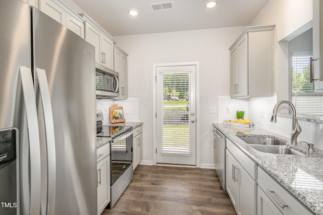 1230 Adrian Ct, Mebane, NC 27302 - kitchen featuring appliances with stainless steel finishes, a sink, dark wood finished floors, backsplash, and plenty of natural light
