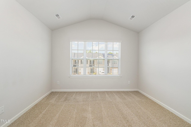 1230 Adrian Ct, Mebane, NC 27302 - unfurnished room featuring light colored carpet, lofted ceiling, and baseboards
