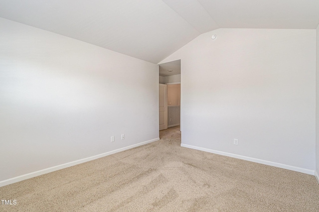 1230 Adrian Ct, Mebane, NC 27302 - spare room with vaulted ceiling, light carpet, and baseboards