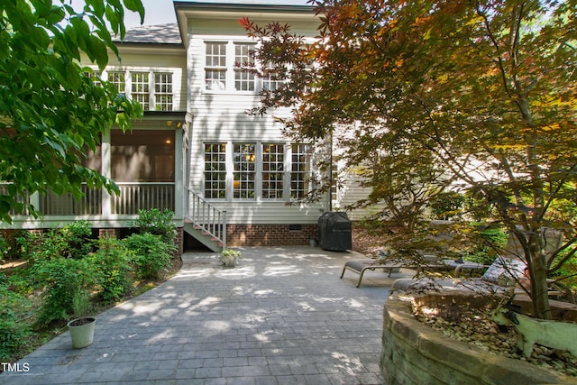 1329 Wynncrest Ct, Raleigh, NC 27603 - back of property with crawl space, a patio area, and a sunroom