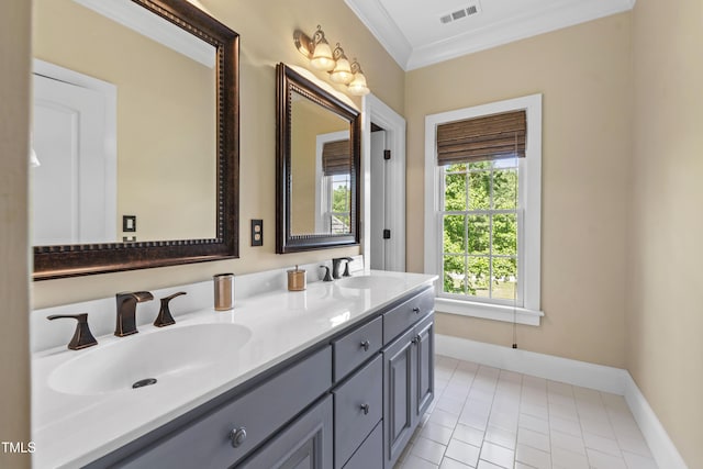 1329 Wynncrest Ct, Raleigh, NC 27603 - bathroom featuring double vanity, tile patterned floors, crown molding, and baseboards