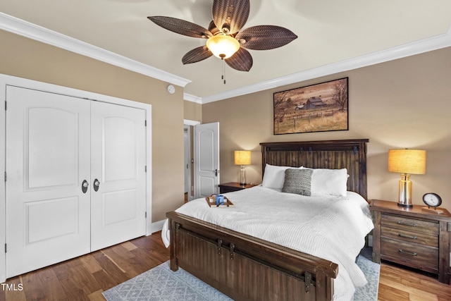 1329 Wynncrest Ct, Raleigh, NC 27603 - bedroom featuring ornamental molding, wood finished floors, a closet, ceiling fan, and baseboards