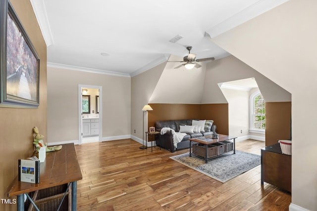 1329 Wynncrest Ct, Raleigh, NC 27603 - living room with wood finished floors, ceiling fan, baseboards, and crown molding