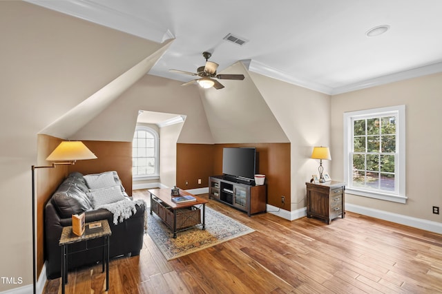 1329 Wynncrest Ct, Raleigh, NC 27603 - living area with plenty of natural light, light wood-style floors, a ceiling fan, ornamental molding, and lofted ceiling
