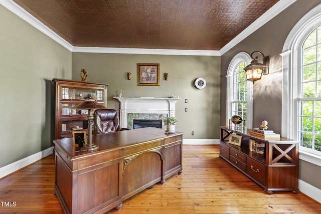 1329 Wynncrest Ct, Raleigh, NC 27603 - office with plenty of natural light, a fireplace, light wood finished floors, and ornamental molding