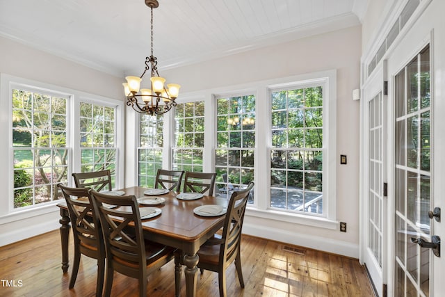 1329 Wynncrest Ct, Raleigh, NC 27603 - sunroom / solarium featuring healthy amount of natural light, a chandelier, and french doors