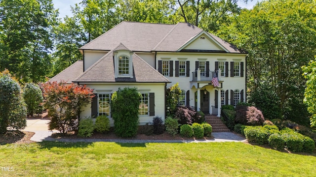 1329 Wynncrest Ct, Raleigh, NC 27603 - view of front facade with a front yard and a shingled roof