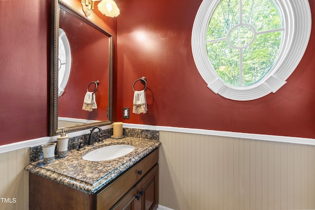 1329 Wynncrest Ct, Raleigh, NC 27603 - bathroom with wainscoting and vanity