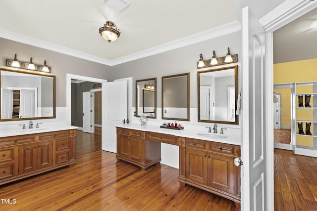 1329 Wynncrest Ct, Raleigh, NC 27603 - bathroom with vanity, ornamental molding, and wood-type flooring