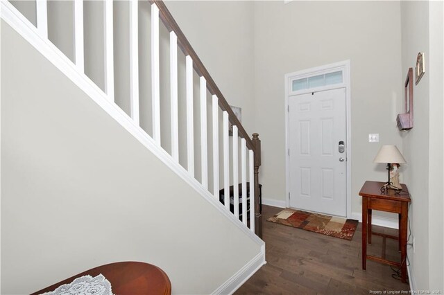 3821 Shire St, Hope Mills, NC 28348 - entrance foyer with wood finished floors, stairs, baseboards, and a high ceiling