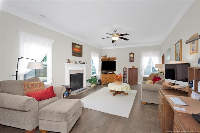 3821 Shire St, Hope Mills, NC 28348 - living room featuring wood finished floors, a fireplace with flush hearth, crown molding, and ceiling fan