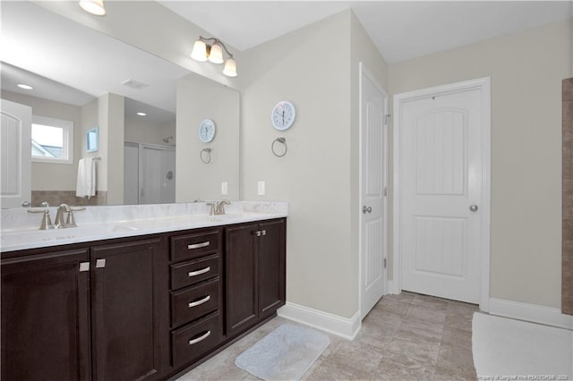 3821 Shire St, Hope Mills, NC 28348 - bathroom with baseboards, double vanity, and an enclosed shower