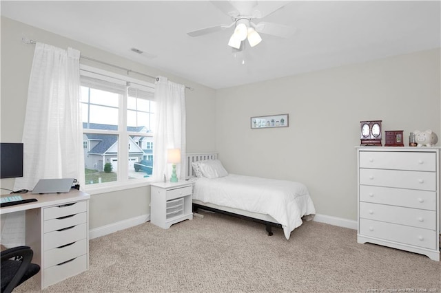3821 Shire St, Hope Mills, NC 28348 - bedroom with light colored carpet, baseboards, a desk, and ceiling fan