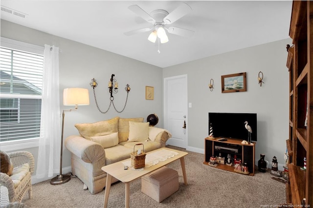 3821 Shire St, Hope Mills, NC 28348 - living room featuring ceiling fan, carpet flooring, and baseboards