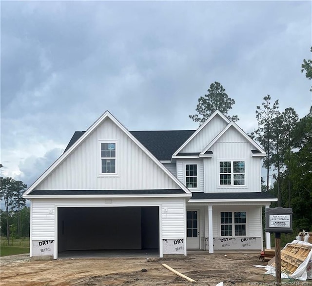 400 Whitestone Dr, Fayetteville, NC 28312 - view of front of property with covered porch, board and batten siding, a garage, and driveway