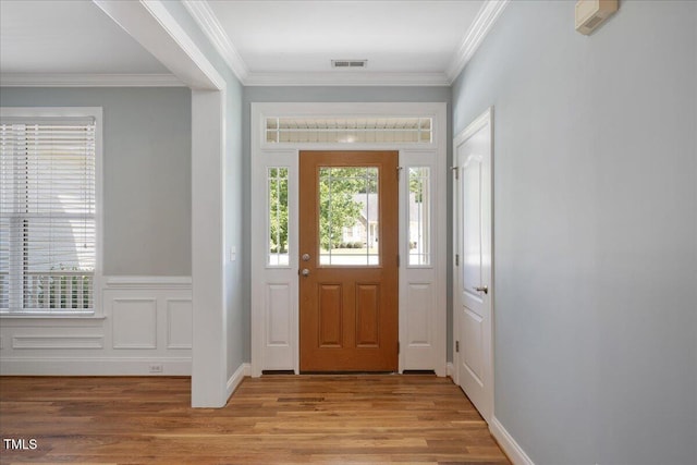 120 Tanager Farms Dr, Youngsville, NC 27596 - entrance foyer with light wood finished floors and ornamental molding