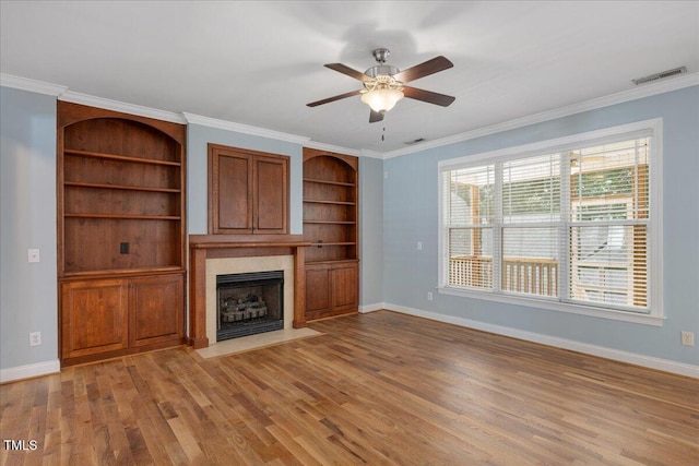 120 Tanager Farms Dr, Youngsville, NC 27596 - unfurnished living room with a fireplace, light wood-style flooring, baseboards, ceiling fan, and ornamental molding