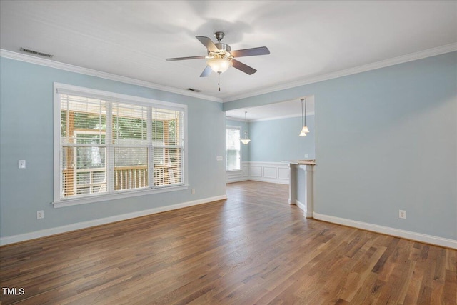 120 Tanager Farms Dr, Youngsville, NC 27596 - empty room with a ceiling fan, crown molding, wood finished floors, and baseboards