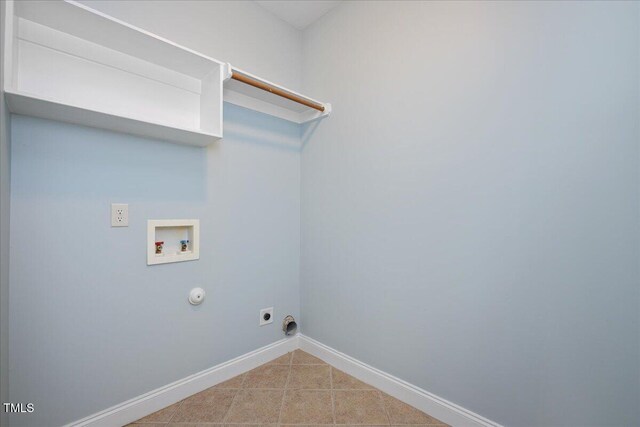 120 Tanager Farms Dr, Youngsville, NC 27596 - laundry area with hookup for a washing machine, baseboards, gas dryer hookup, tile patterned floors, and electric dryer hookup