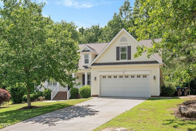 120 Tanager Farms Dr, Youngsville, NC 27596 - view of front of house featuring concrete driveway, a front lawn, covered porch, an attached garage, and a shingled roof