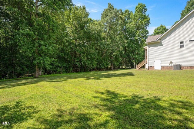 120 Tanager Farms Dr, Youngsville, NC 27596 - view of green lawn featuring cooling unit and stairway
