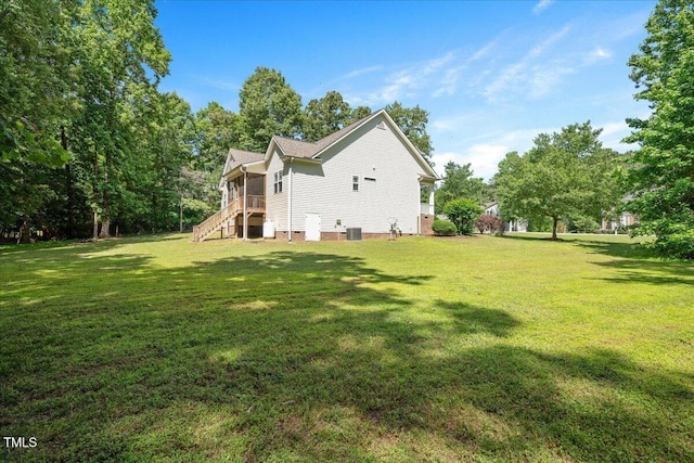 120 Tanager Farms Dr, Youngsville, NC 27596 - rear view of property with a lawn, stairs, a sunroom, and central AC unit