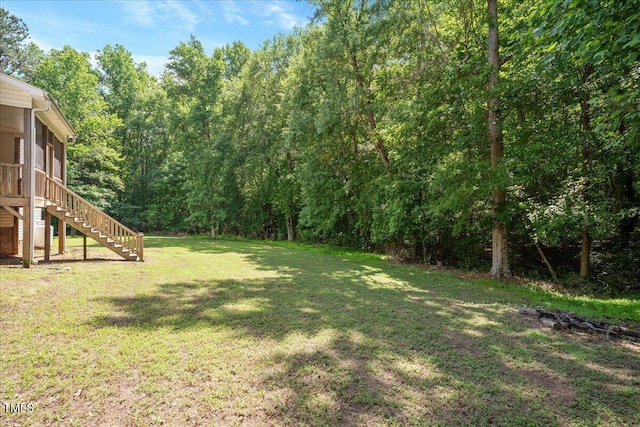120 Tanager Farms Dr, Youngsville, NC 27596 - view of grassy yard featuring stairs and a wooded view