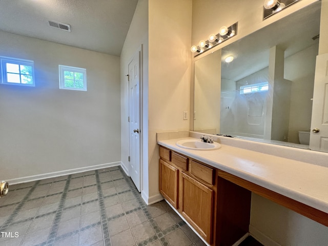 5911 Endsley Ct, Raleigh, NC 27610 - bathroom with a shower, vanity, baseboards, and toilet