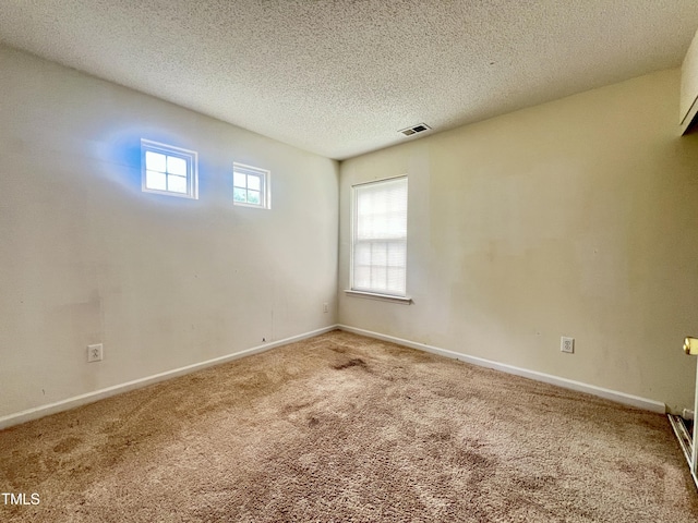 5911 Endsley Ct, Raleigh, NC 27610 - carpeted empty room featuring a textured ceiling and baseboards