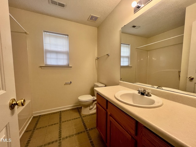 5911 Endsley Ct, Raleigh, NC 27610 - full bathroom featuring toilet, a textured ceiling, baseboards, tile patterned flooring, and vanity