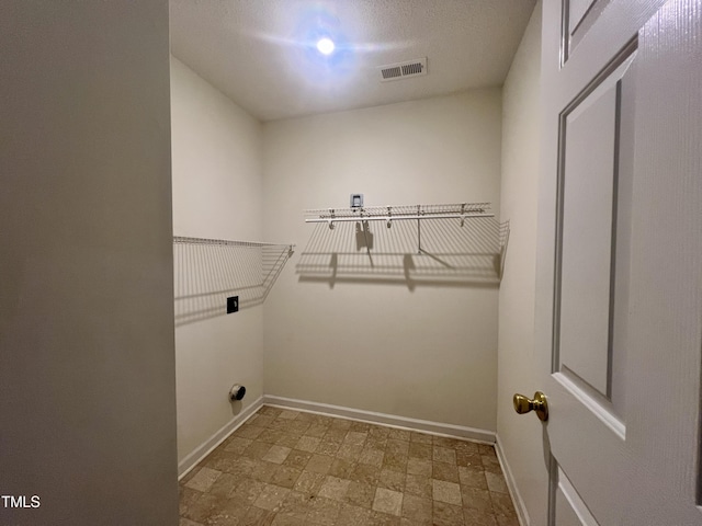 5911 Endsley Ct, Raleigh, NC 27610 - washroom featuring baseboards, hookup for an electric dryer, and tile patterned floors
