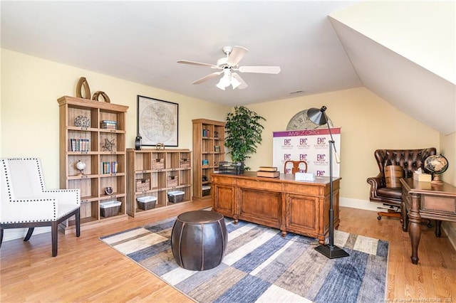  - home office with light wood-style floors, a ceiling fan, and vaulted ceiling