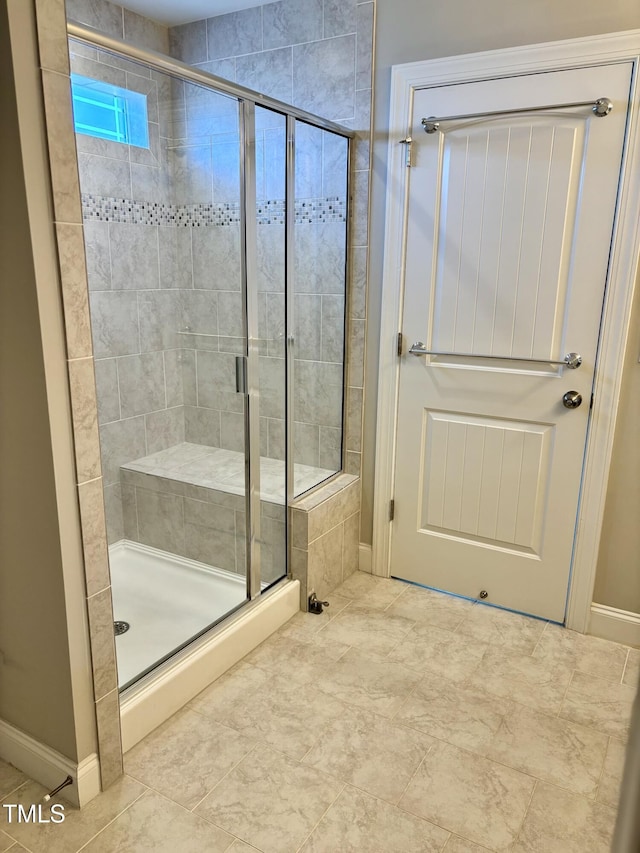123 Gunderson Ln, Garner, NC 27529 - bathroom with a stall shower and baseboards