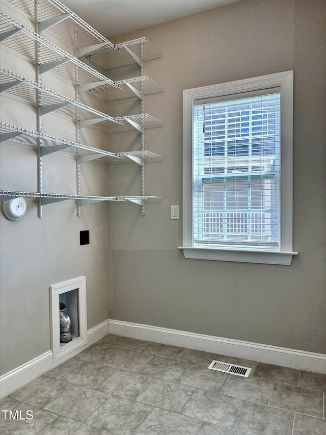 123 Gunderson Ln, Garner, NC 27529 - laundry room with baseboards