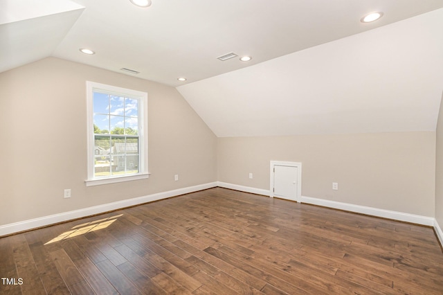 123 Gunderson Ln, Garner, NC 27529 - bonus room featuring vaulted ceiling, baseboards, dark wood-type flooring, and recessed lighting