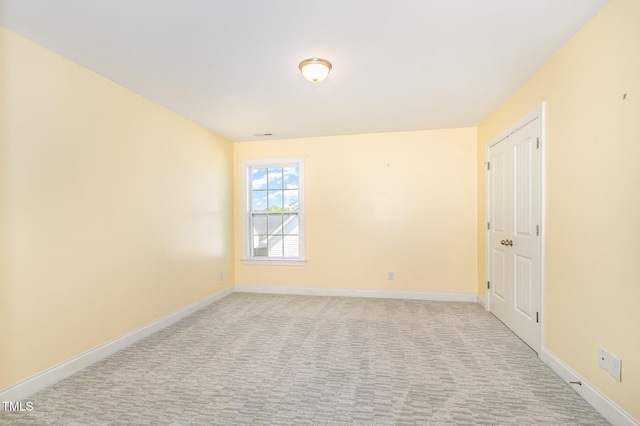 123 Gunderson Ln, Garner, NC 27529 - spare room featuring baseboards and light colored carpet