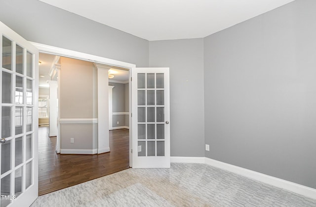 123 Gunderson Ln, Garner, NC 27529 - carpeted spare room with baseboards, french doors, and wood finished floors