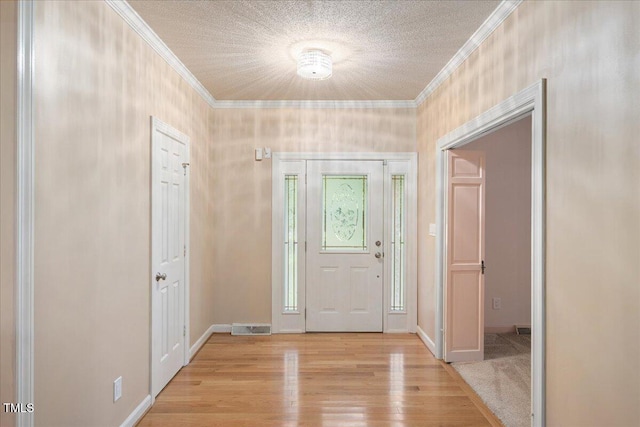 8133 Holly Forest Rd, Wake Forest, NC 27587 - entryway featuring ornamental molding, light wood finished floors, a textured ceiling, and baseboards