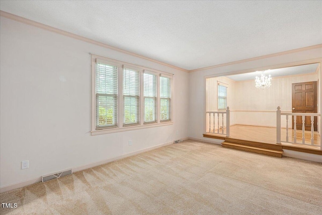 8133 Holly Forest Rd, Wake Forest, NC 27587 - empty room with a chandelier, carpet floors, ornamental molding, baseboards, and a textured ceiling