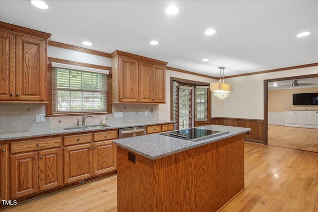 8133 Holly Forest Rd, Wake Forest, NC 27587 - kitchen with a sink, black electric stovetop, a wainscoted wall, brown cabinetry, and dishwasher