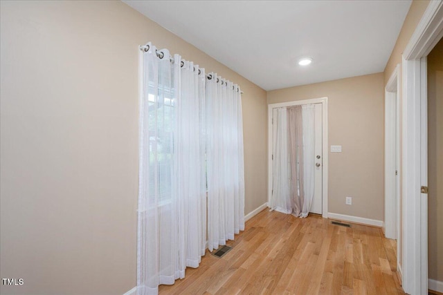 8133 Holly Forest Rd, Wake Forest, NC 27587 - corridor with baseboards, light wood-type flooring, and recessed lighting