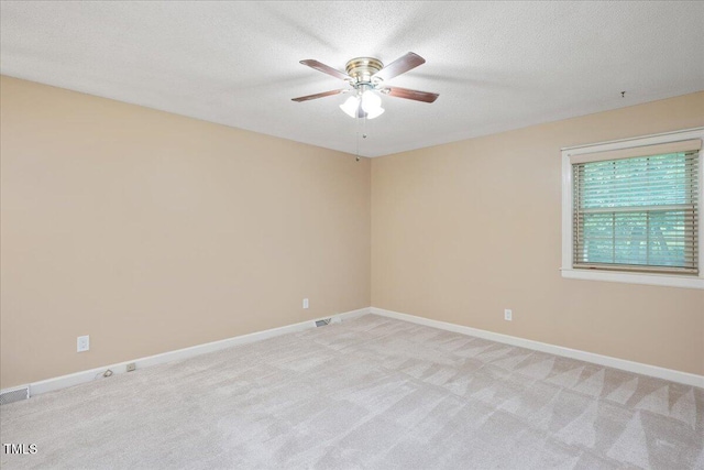 8133 Holly Forest Rd, Wake Forest, NC 27587 - spare room with a ceiling fan, light carpet, baseboards, and a textured ceiling