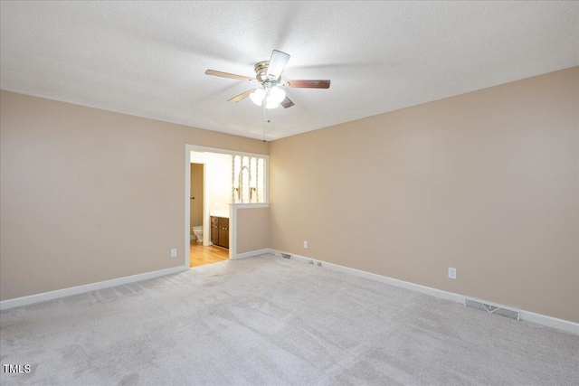 8133 Holly Forest Rd, Wake Forest, NC 27587 - unfurnished room with a ceiling fan, light carpet, baseboards, and a textured ceiling