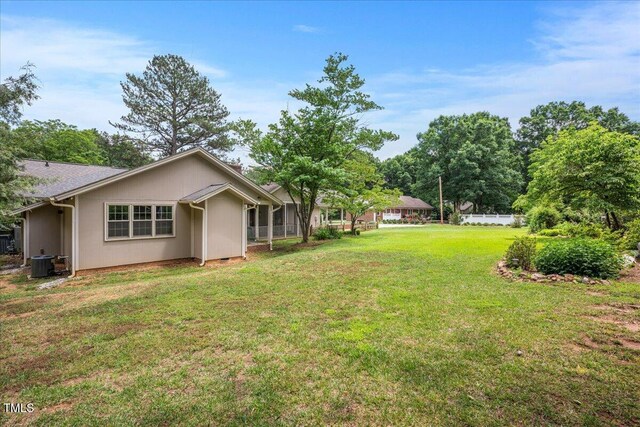 8133 Holly Forest Rd, Wake Forest, NC 27587 - view of grassy yard featuring central air condition unit