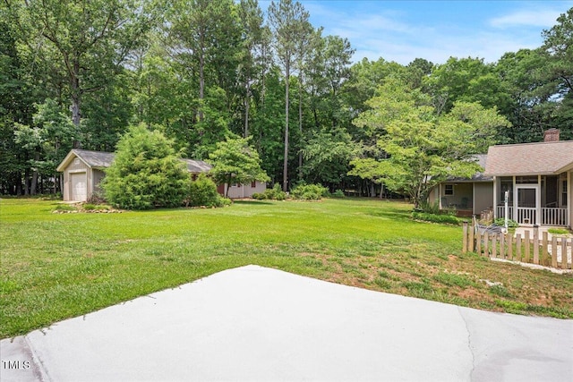 8133 Holly Forest Rd, Wake Forest, NC 27587 - view of grassy yard featuring a sunroom and a patio