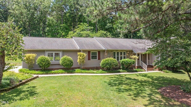 8133 Holly Forest Rd, Wake Forest, NC 27587 - ranch-style home with a front lawn and a shingled roof