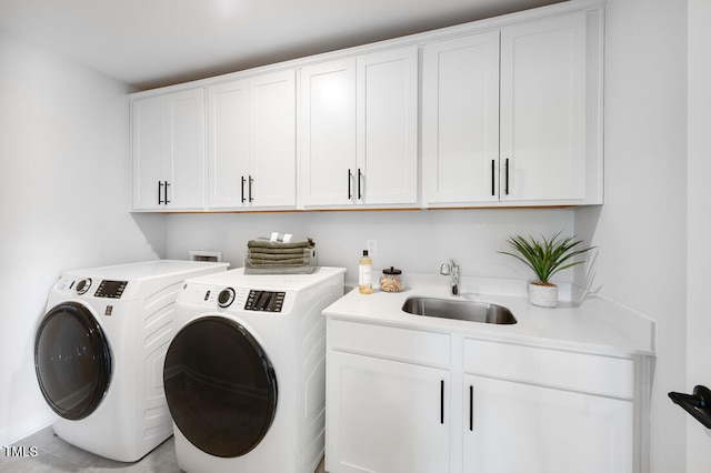 laundry room with washer and dryer and cabinet space