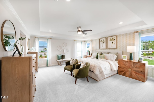 carpeted bedroom featuring a tray ceiling, recessed lighting, baseboards, wallpapered walls, and ceiling fan