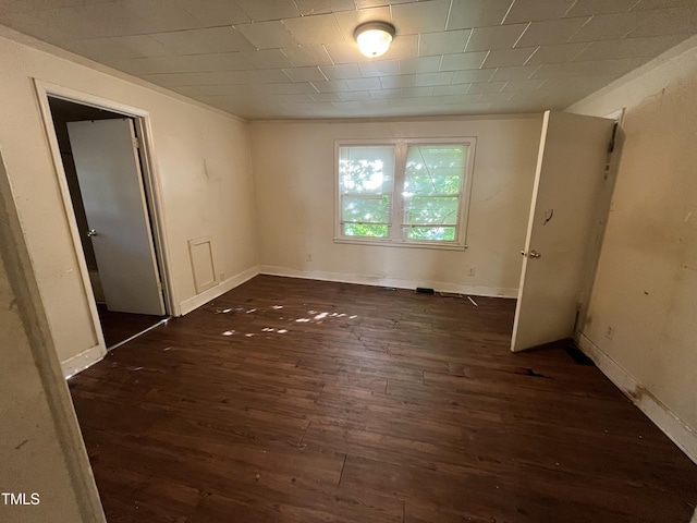 spare room with wood finished floors