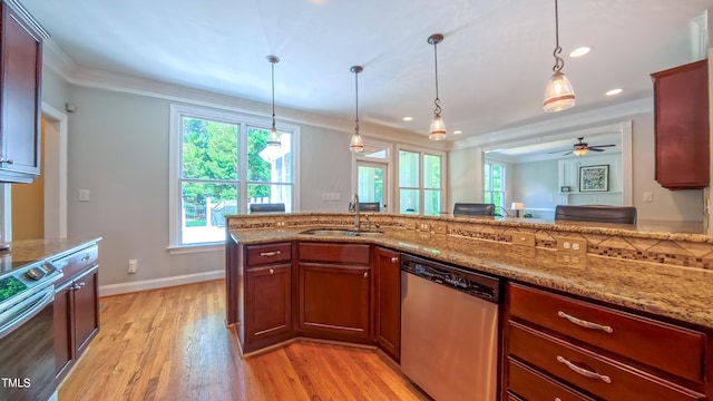 8042 Hogan Dr, Wake Forest, NC 27587 - kitchen with stainless steel appliances, a sink, ornamental molding, healthy amount of natural light, and light stone countertops